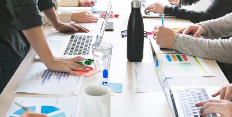 hands-on-desk-at-meeting